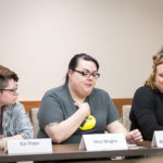 3 people speaking on a panel