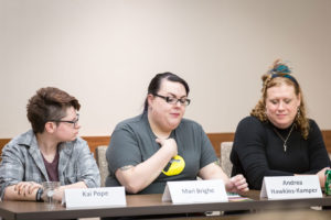 3 people speaking on a panel